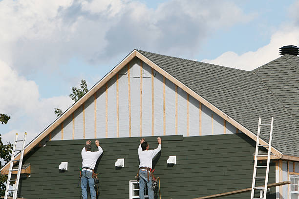Professional Siding technician working in West Sayville, NY